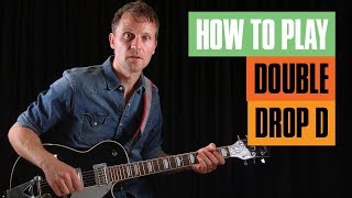 How to Play Double Drop D Tuning  Guitar Tricks [upl. by Atinuhs]